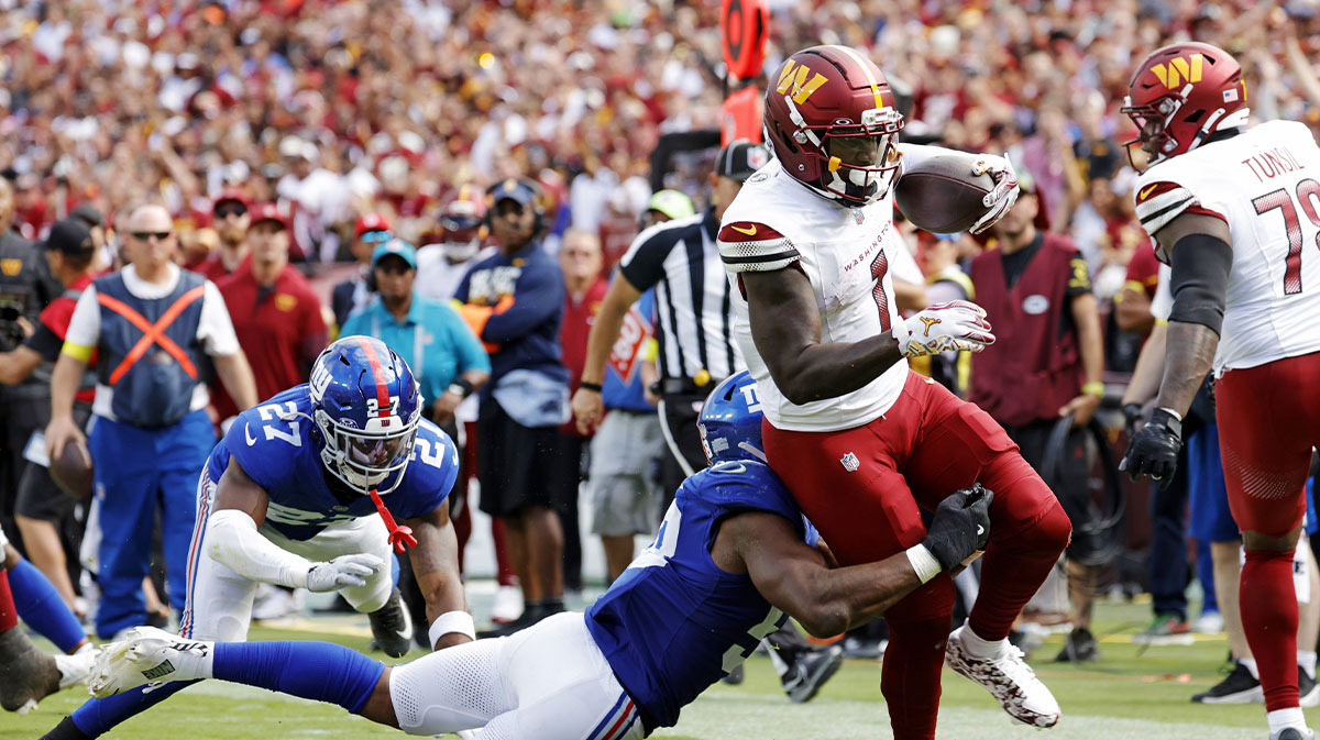 Washington Commanders wide receiver Deebo Samuel (1) goes for a touchdown during the third quarter against the New York Giants at Northwest Stadium.