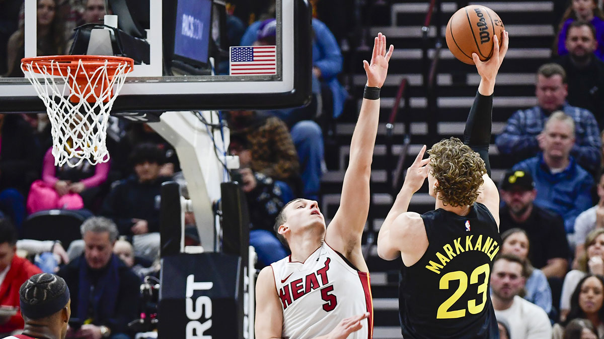 Jazz forward/center Lauri Markkanen (23) bumps into Miami Heat forward Nikola Jovic (5) before a shot during the second half at Vivint Arena with Serbia in the background