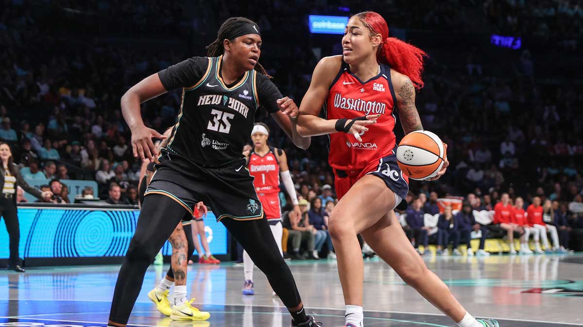 Washington Mystics forward Shakira Austin (0) looks to drive past New York Liberty center Jonquel Jones (35) in the first quarter at Barclays Center.