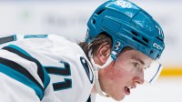 San Jose Sharks forward Macklin Celebrini (71) prepares for a face-off against the Vancouver Canucks in overtime at Rogers Arena.