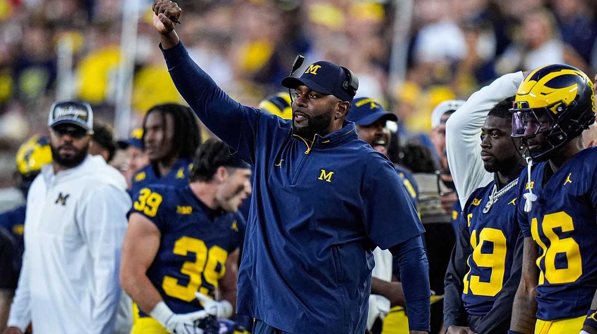 Michigan head coach Sherrone Moore reacts to a play against New Mexico during the first half at Michigan Stadium