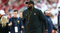 Michigan Wolverines head coach Sherrone Moore stands on the sideline prior to a game against the Oklahoma Sooners at Gaylord Family-Oklahoma Memorial Stadium.
