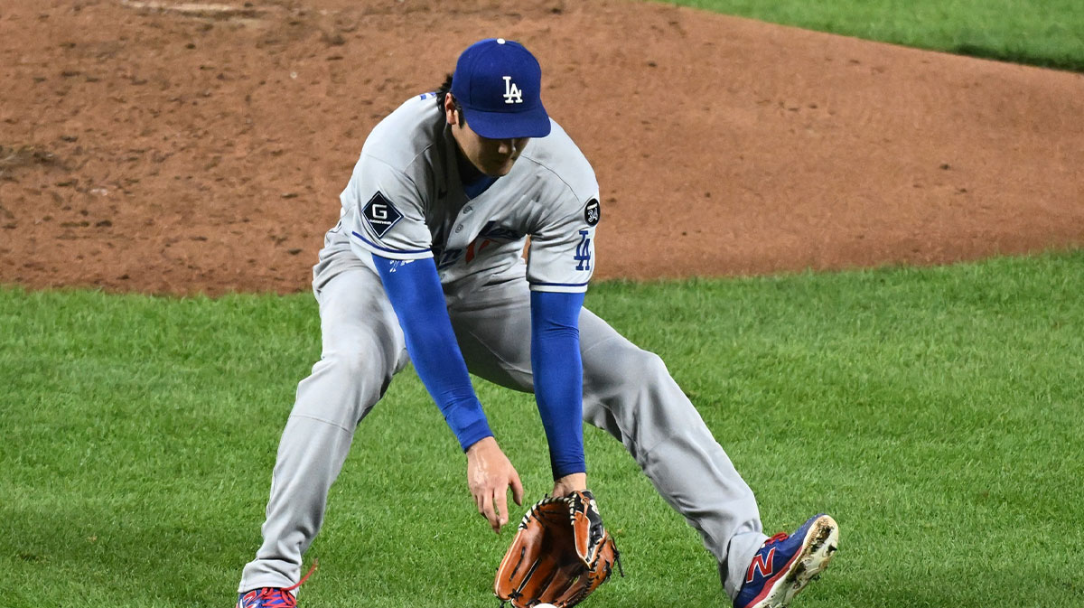 Los Angeles Dodgers two-way player Shohei Ohtani (17) fields a ground ball during the third inning against the Baltimore Orioles at Oriole Park at Camden Yards.