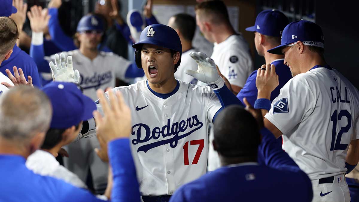 Los Angeles Dodgers designated hitter Shohei Ohtani (17) is greeted in the dugout after hitting a three-run home run during the fifth inning against the San Francisco Giants at Dodger Stadium.