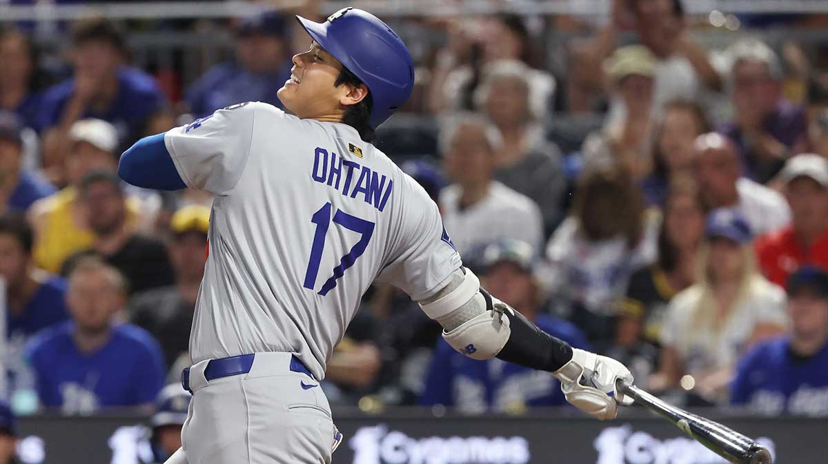 Los Angeles Dodgers two-way player Shohei Ohtani (17) hits an infield single against the Pittsburgh Pirates during the seventh inning at PNC Park.