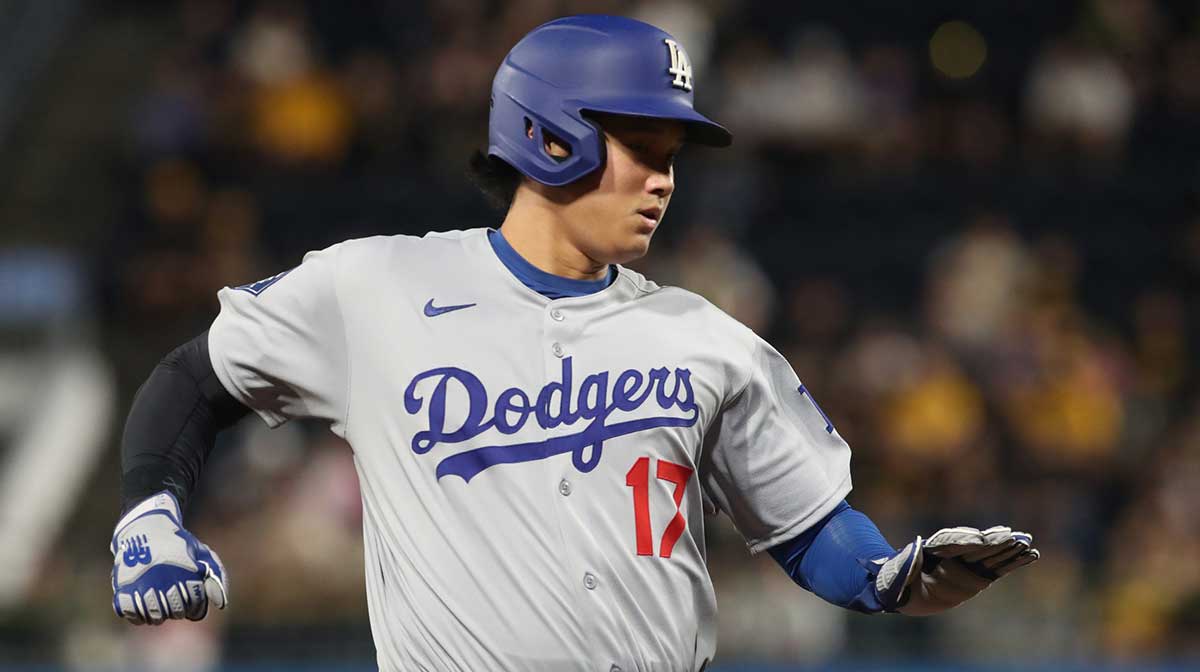 Los Angeles Dodgers two-way player Shohei Ohtani (17) runs to third base against the Pittsburgh Pirates during the seventh inning at PNC Park.