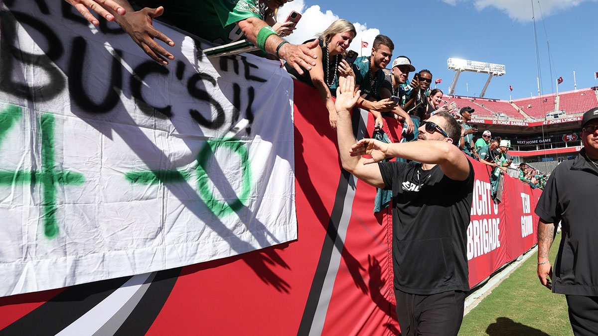 Philadelphia Eagles head coach Nick Sirianni high fives fans after the game against the Tampa Bay Buccaneers at Raymond James Stadium.