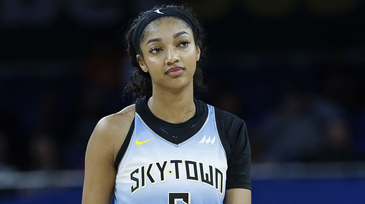 Sky forward Angel Reese (5) walks on the court during the second half of a WNBA game against the Connecticut Sun at Wintrust Arena with the Aces logo in the background