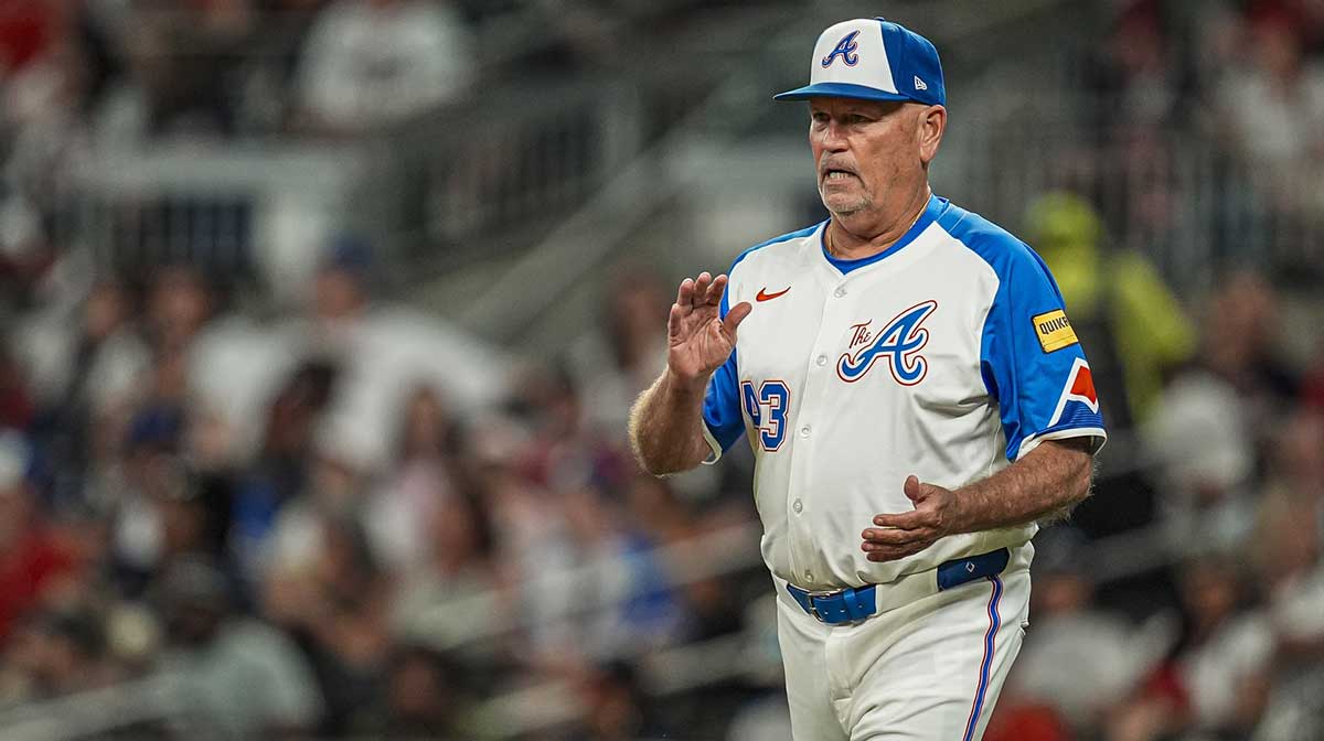 Atlanta Braves manager Brian Snitker (43) walks to the mound to change pitchers against the New York Mets during the seventh inning at Truist Park.