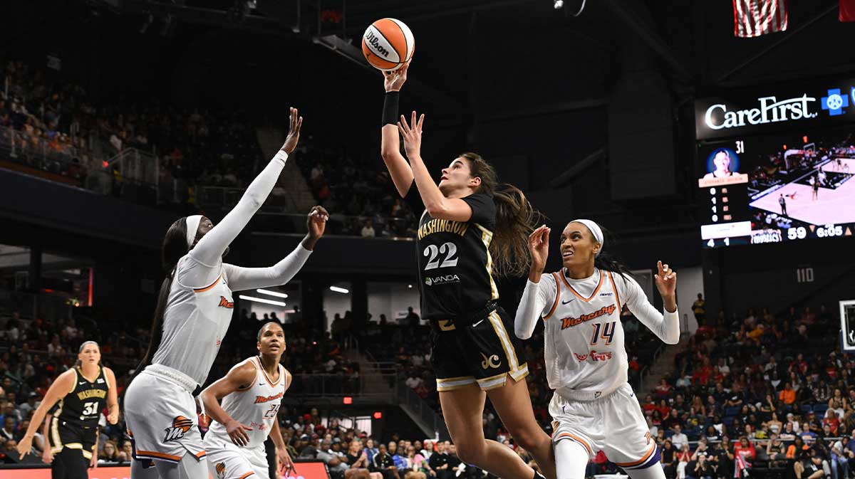 Sep 4, 2025; Washington, District of Columbia, USA; Washington Mystics guard Sonia Citron (22) attempts a shot between Phoenix Mercury guard Kahleah Copper (2) and forward DeWanna Bonner (14) during the fourth quarter at CareFirst Arena. Mandatory Credit: Rafael Suanes-Imagn Images