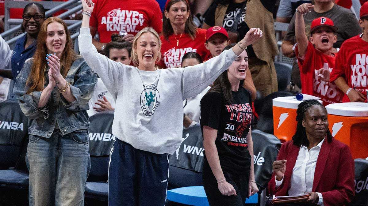 Indiana Fever guard Caitlin Clark (22) and guard Sophie Cunningham (8) on the sideline during game two of round one against the Atlanta Dream for the 2025 WNBA Playoffs at Gainbridge Fieldhouse.