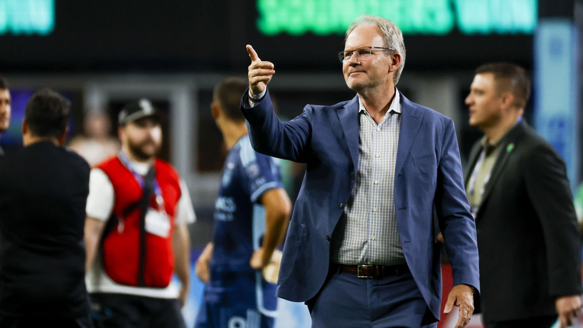Sounders coach Brian Schmetzer shares a moment with Lionel Messi after Luis Suarez's spitting incident in the Leagues Cup vs Inter Miami.
