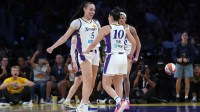 LA Sparks forward Dearica Hamby (5) and guard Kelsey Plum (10) celebrate against the Washington Mystics in the second half at Crypto.com Arena.