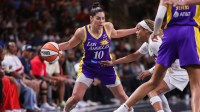 Sparks guard Kelsey Plum (10) is defended by Dream's Jordin Canada