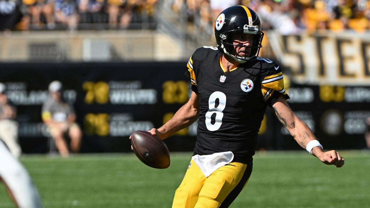 Pittsburgh Steelers quarterback Aaron Rodgers (8) looks to elude Seattle Seahawks cornerback Josh Jobe (29) during the second half at Acrisure Stadium.