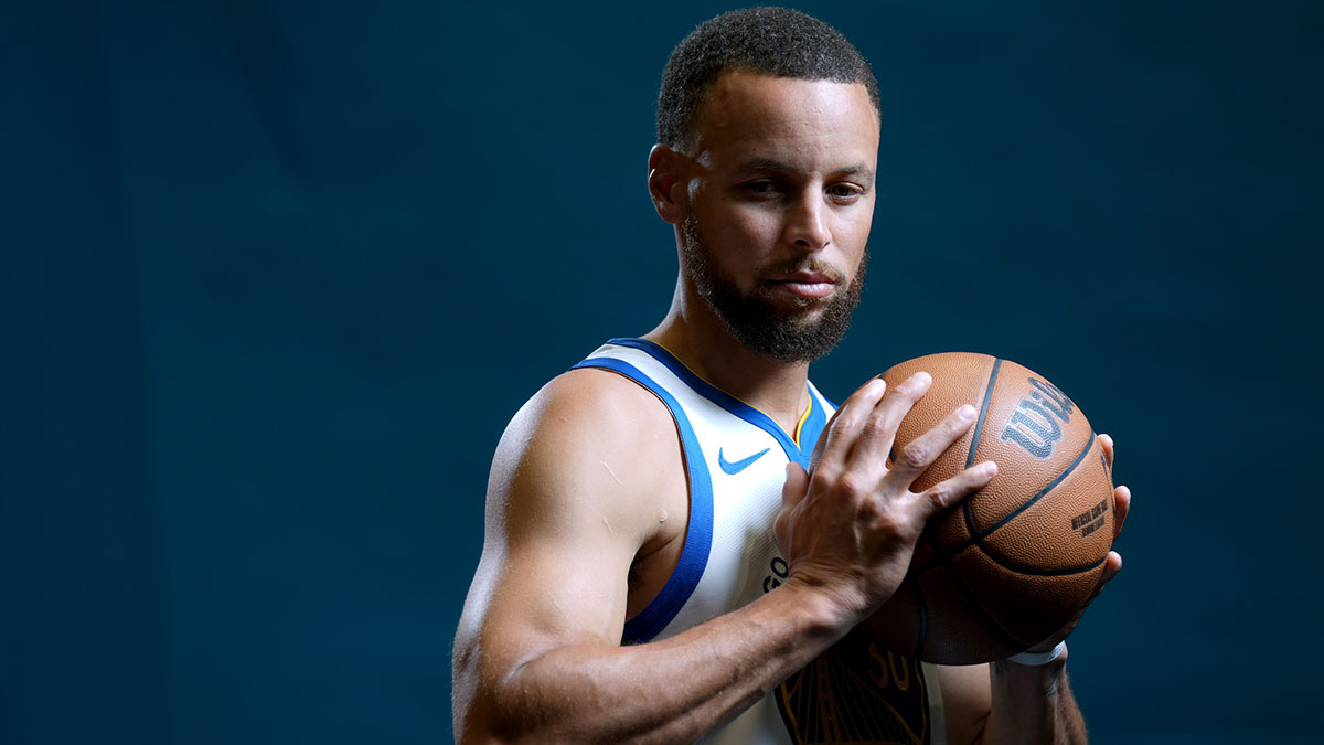 Golden State Warriors guard Stephen Curry (30) holds onto the ball during Media Day at the Chase Center.