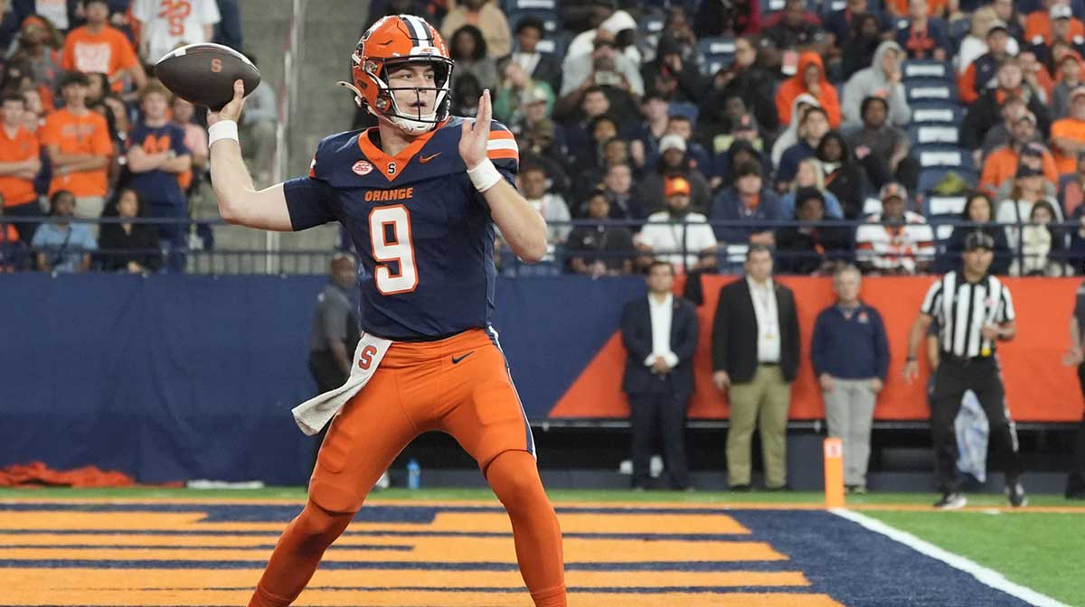Syracuse Orange quarterback Steve Angeli (9) throws against the UConn Huskies during the second half at JMA Wireless Dome.