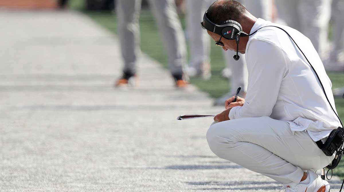 Texas Longhorns head coach Steve Sarkisian takes notes during the first half against the Texas El Paso Miners at Darrell K Royal-Texas Memorial Stadium.
