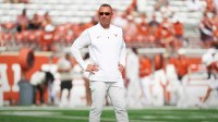 Texas Longhorns head coach Steve Sarkisian watches his team warm up before the game against San Jose State Spartans at Darrell K Royal-Texas Memorial Stadium.
