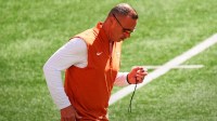 Texas Longhorns head coach Steve Sarkisian runs across the field during warm-ups prior to the NCAA football game against the Ohio State Buckeyes at Ohio Stadium on Aug. 30, 2025.