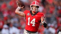 Georgia Bulldogs quarterback Gunner Stockton (14) throws a pass against the Austin Peay Governors in the fourth quarter at Sanford Stadium.
