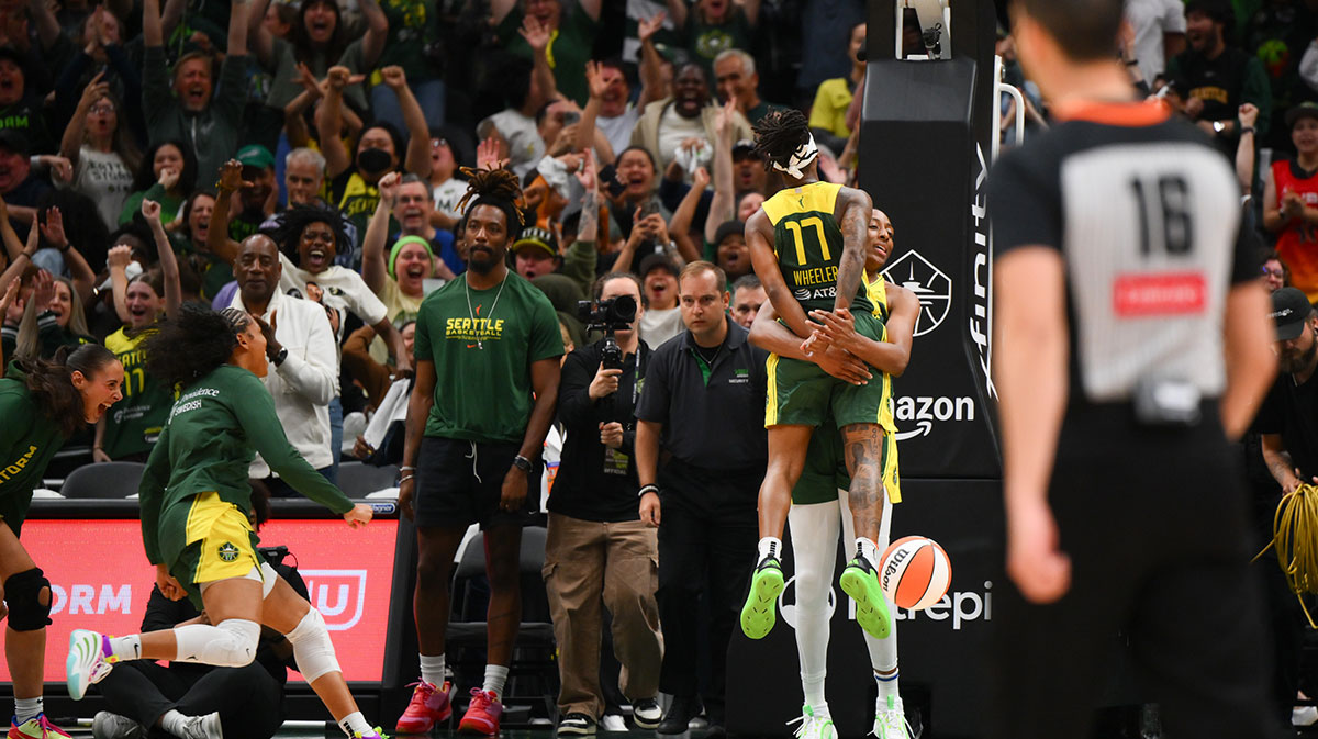 Wheeler (17) and forward Nneka Ogwumike (3) celebrate after defeating the Golden State Valkyries at Climate Pledge Arena. 