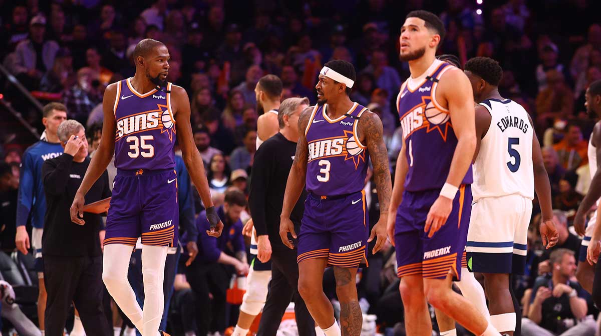 Phoenix Suns forward Kevin Durant (35) with guard Bradley Beal (3) and Devin Booker (1) against the Minnesota Timberwolves at Footprint Center.