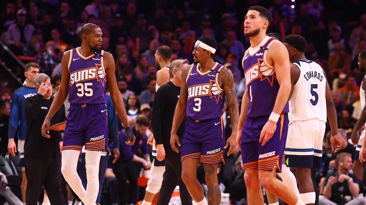 Suns forward Kevin Durant (35) with guard Bradley Beal (3) and Devin Booker (1) against the Minnesota Timberwolves at Footprint Center