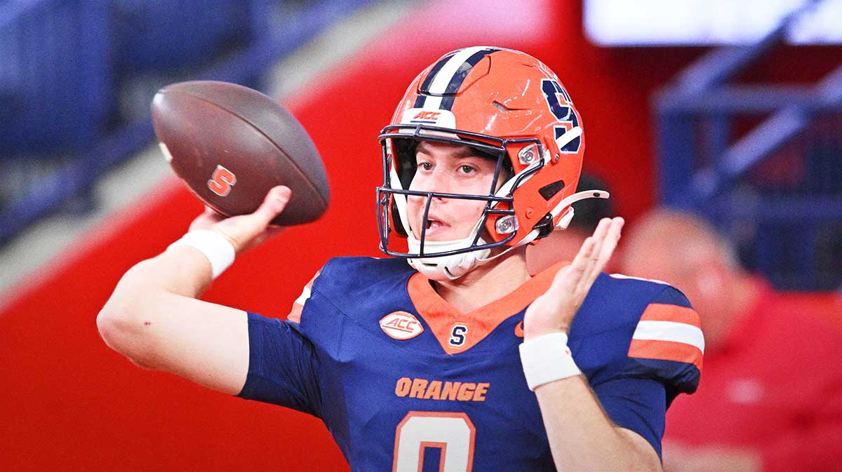 Syracuse Orange quarterback Steve Angeli (9) warms up before a game against the Colgate Raiders at JMA Wireless Dome.