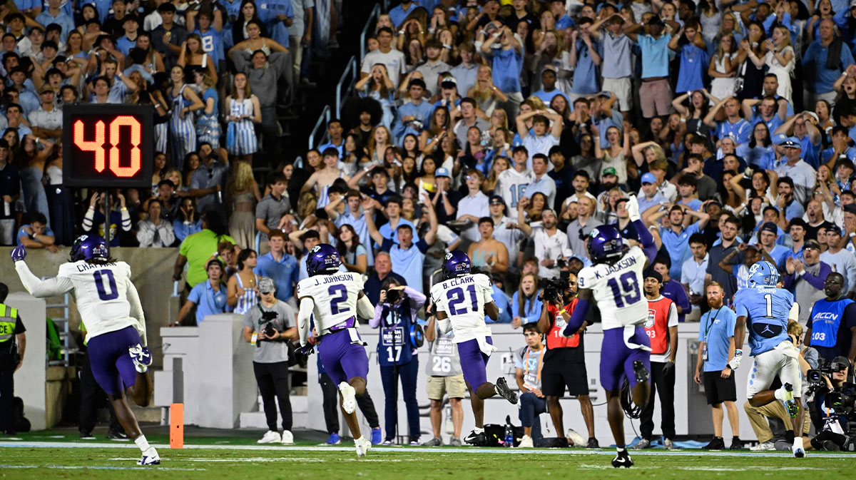 TCU Horned Frogs safety Bud Clark (21) intercepts a pass and returns it for a touchdown in the second quarter at Kenan Stadium.