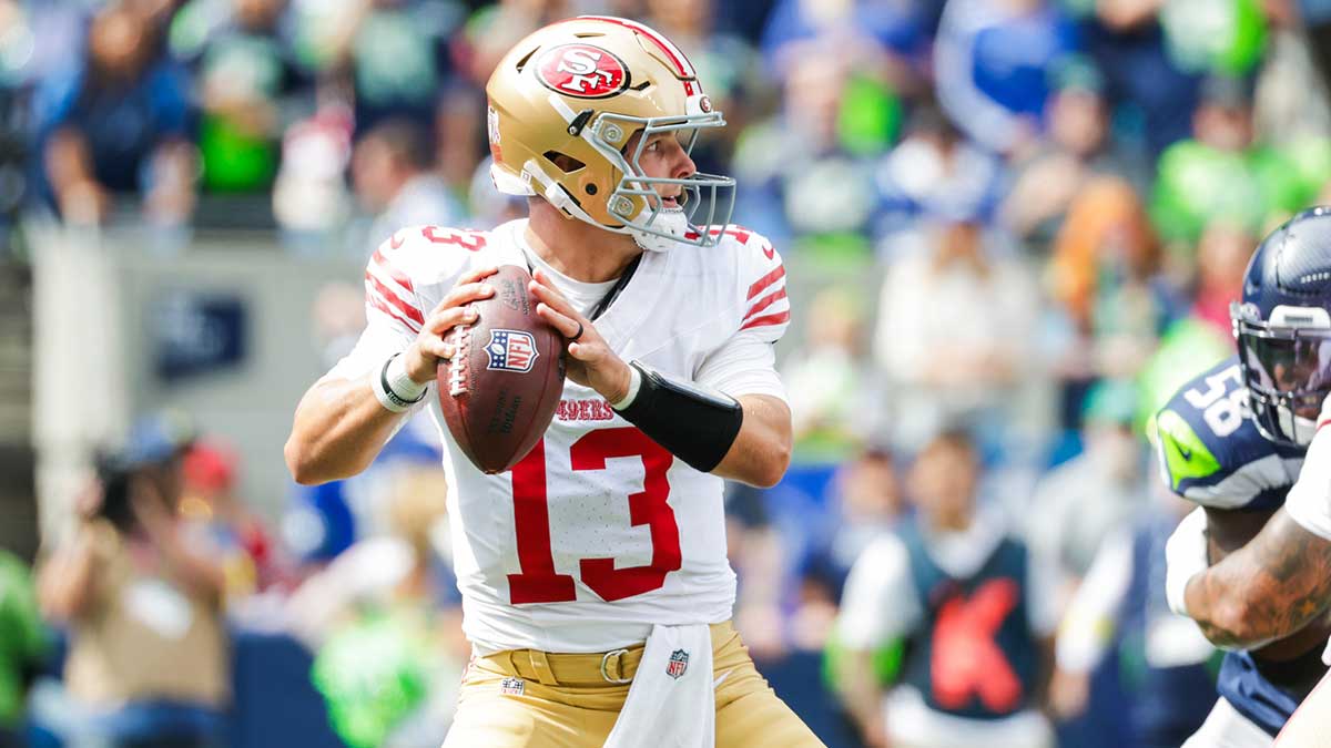 San Francisco 49ers quarterback Brock Purdy (13) looks to pass against the Seattle Seahawks during the first quarter at Lumen Field.