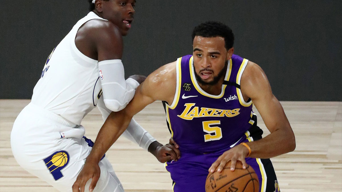 Los Angeles Lakers guard Talen Horton-Tucker (5) drives to the basket against Indiana Pacers guard Aaron Holiday (3) during the second quarter in a NBA basketball game at The Field House.