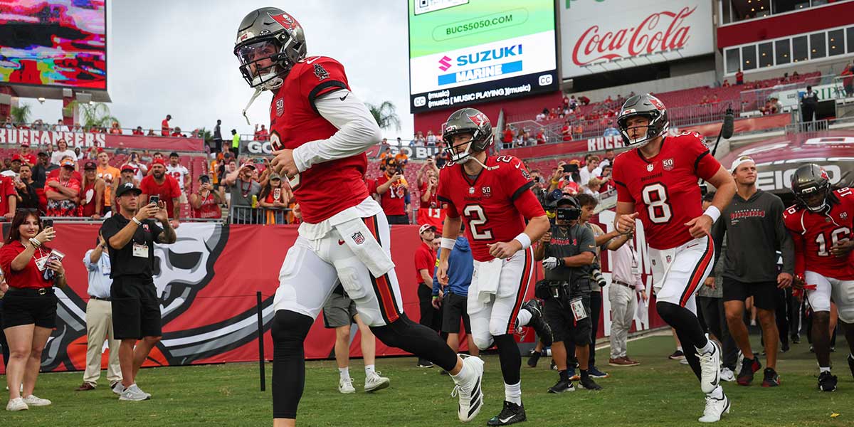 Tampa Bay Buccaneers quarterback Baker Mayfield (6) quarterback Kyle Trask (2) and quarterback Connor Bazelak (8) take the field for warm ups before a preseason game against the Tennessee Titans at Raymond James Stadium.