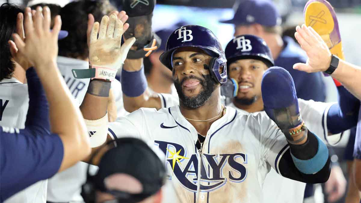 Tampa Bay Rays first base Yandy Diaz (2) is congratulated after he and outfielder Chandler Simpson (14) scored runs during the eighth inning against the Seattle Mariners at George M. Steinbrenner Field.