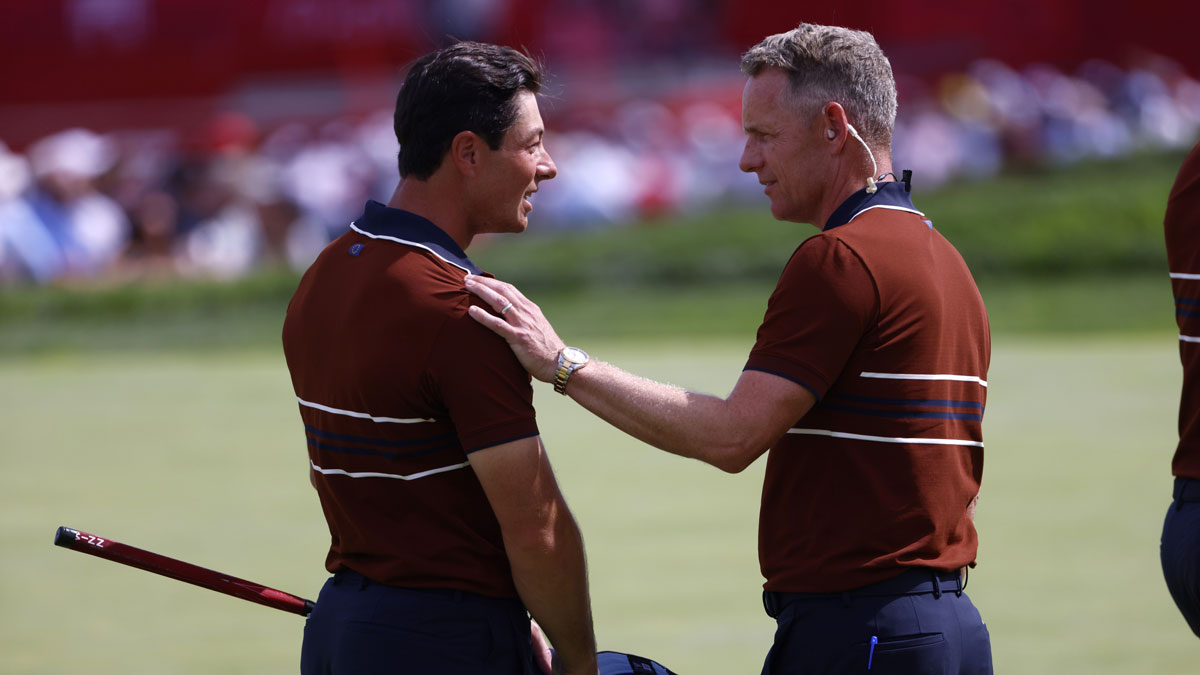 Team Europe captain Luke Donald congratulates golfer Viktor Hovland after winning match on the penultimate day of competition for the Ryder Cup at Bethpage Black.