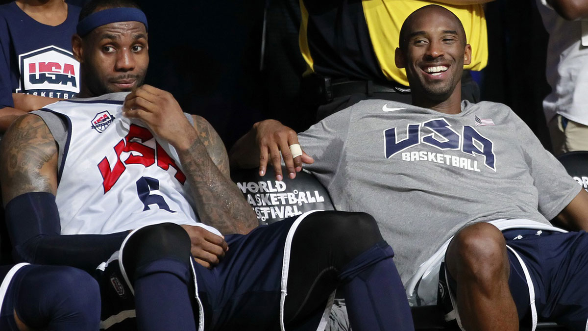 United States and Lakers' LeBron James (6) and United States and Lakers forward Kobe Bryant (10) smile on the sidelines during USA team training at the DC Armory