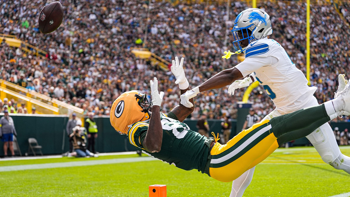 Detroit Lions cornerback Terrion Arnold (6) breaks a pass intended for Green Bay Packers wide receiver Romeo Doubs (87) during the first half at Lambeau Field