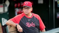 Cincinnati Reds manager Terry Francona (77) sits in the dugout before the start of the game against the Athletics at Sutter Health Park.