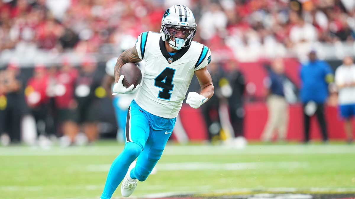 Carolina Panthers wide receiver Tetairoa McMillan (4) runs with the ball during the first quarter against the Arizona Cardinals at State Farm Stadium.