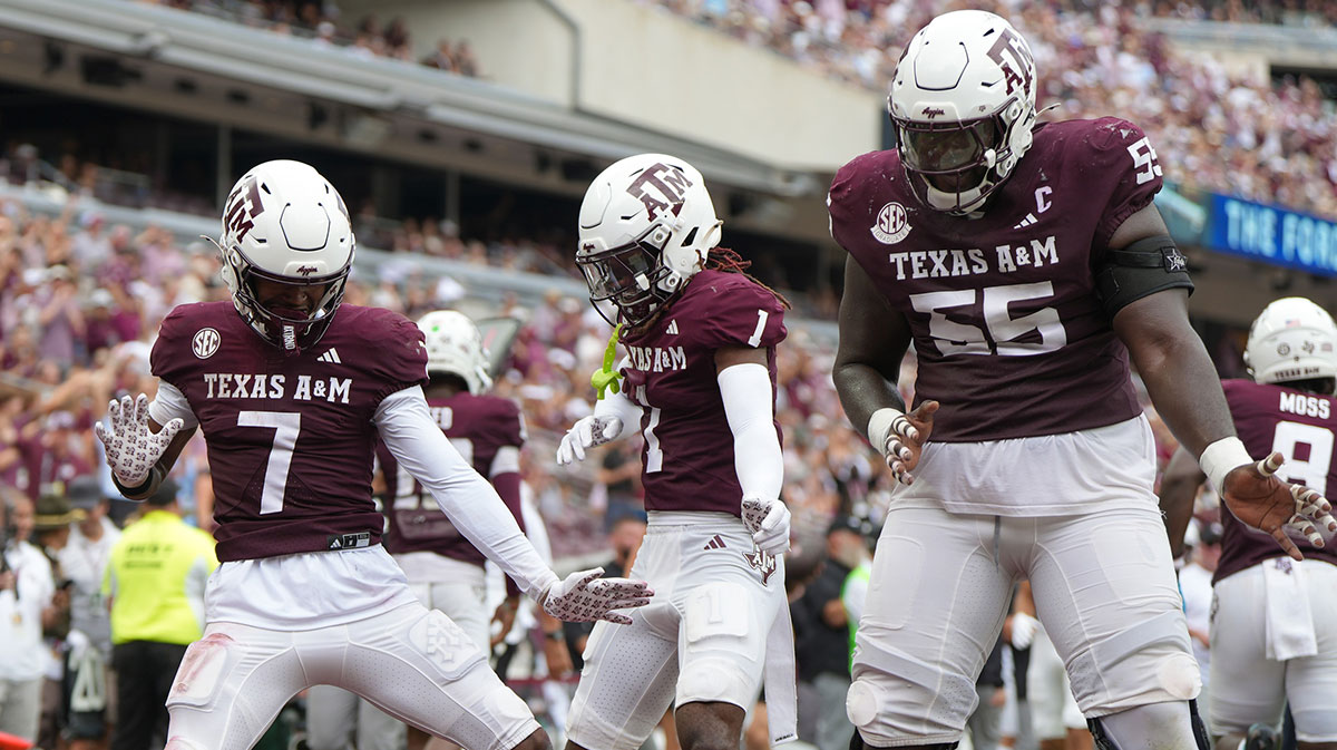 Texas A&M Aggies wide receiver KC Concepcion (7), Texas A&M Aggies wide receiver Mario Craver (1), and Texas A&M Aggies offensive lineman Ar'maj Reed-Adams (55) celebrate after a touchdown during the second quarter against the Utah State Aggies at Kyle Field.