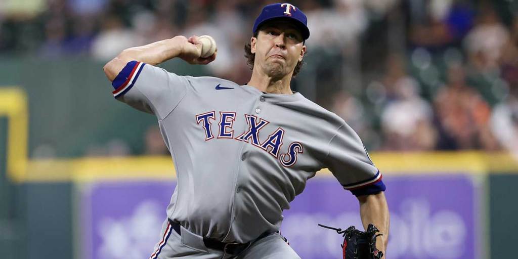 Texas Rangers starting pitcher Jacob deGrom (48) pitches against the Houston Astros in the first inning at Daikin Park