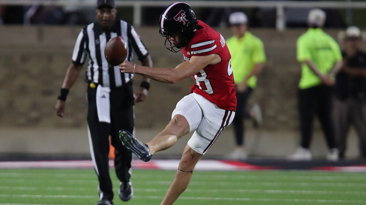 Texas Tech Red Raiders kicker Stone Harrington (48) kicks off in the second half against the Oregon State Beavers at Jones AT&T Stadium.