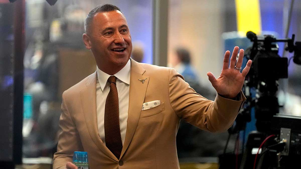 July 15, 2025; Atlanta, GA, USA; Texas head coach Steve Sarkisian waves to fans during SEC Media Days at the College Football Hall of Fame in Atlanta.
