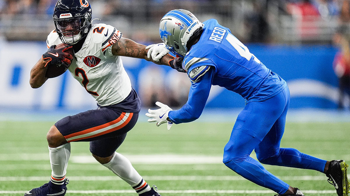 Caption: Detroit Lions cornerback D.J. Reed (4) tries to stop Chicago Bears wide receiver DJ Moore (2) during the first half at Ford Field in Detroit on Sunday, Sept. 14, 2025.