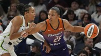 Minnesota Lynx forward Napheesa Collier (24) defends against Phoenix Mercury forward Alyssa Thomas (25) in the first quarter at Target Center.
