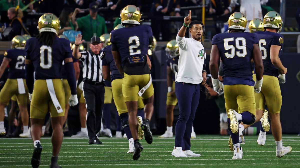 The Notre Dame Fighting Irish react after a play with Notre Dame Fighting Irish head coach Marcus Freeman during the first half against Texas A&M Aggies at Notre Dame Stadium.