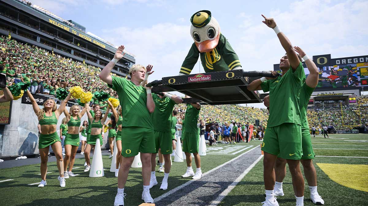 Waddles, the Oregon Ducks mascot, does push ups after a touchdown during the first half against the Montana State Bobcats at Autzen Stadium.