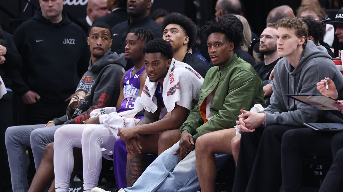 The Utah Jazz bench with several players in street clothes watch the game against the Portland Trail Blazers