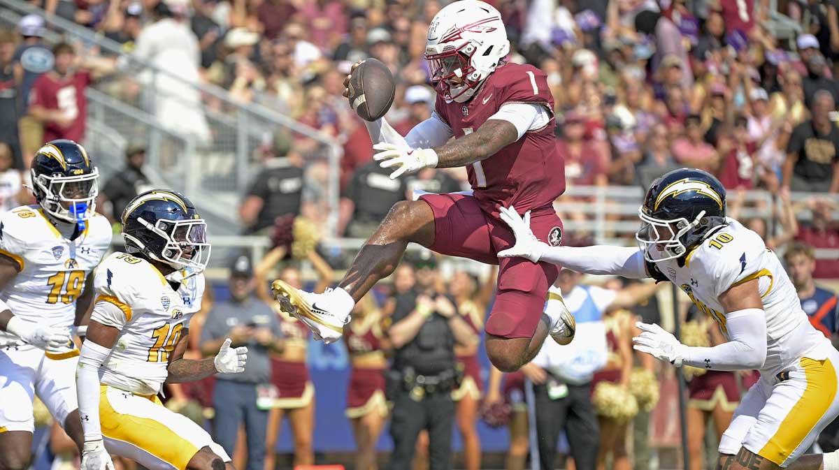 Florida State Seminoles quarterback Thomas Castellanos (1) scores a touchdown during the first half against the Kent State Golden Flashes at Doak S. Campbell Stadium.