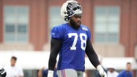 New York Giants offensive tackle Andrew Thomas (78) takes a water break during training camp at Quest Diagnostics Training Center.